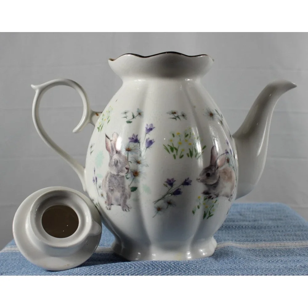 Tea/Coffee pot Elegance rabbit/flower design white bkgrd colored characters VTG